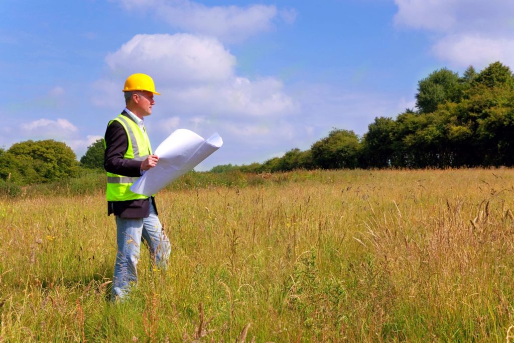 Surveyor reading site plans