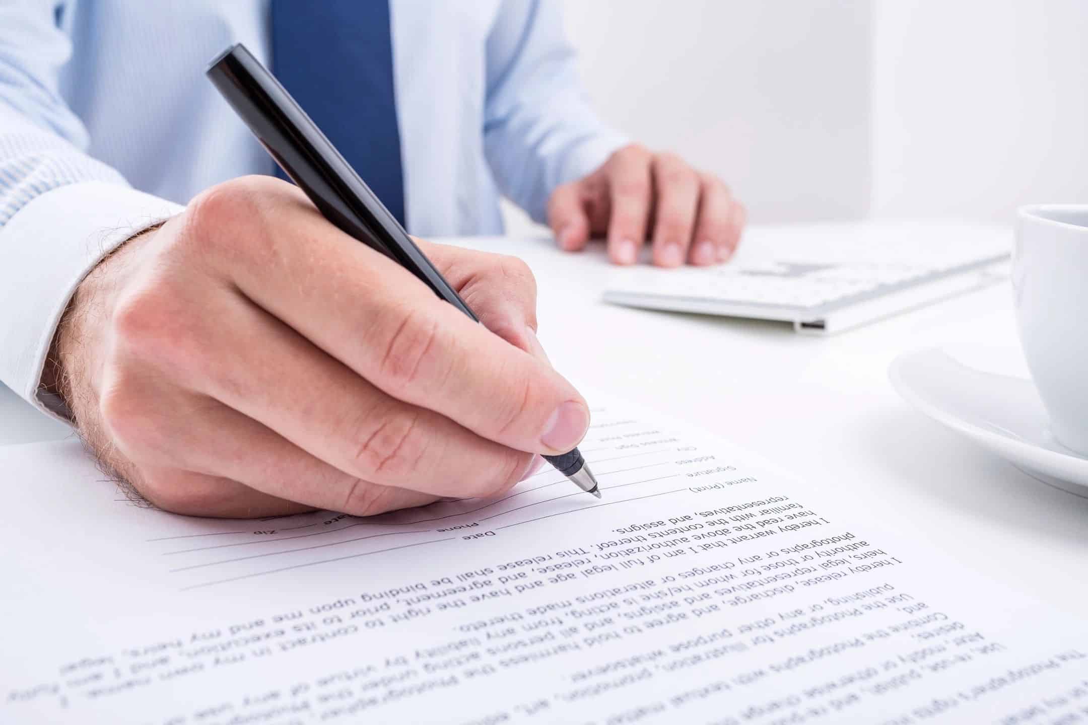 Buyer signing a contract